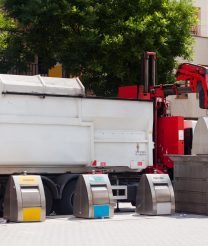recycling-truck-picking-up-bin-city-min